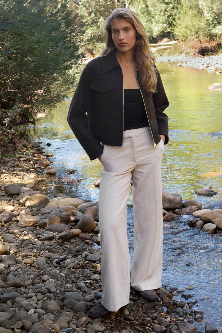 Flattering zip-through collared jacket with comfortable white pants and pocket detailing, relaxed separates for laidback seasonal styling.